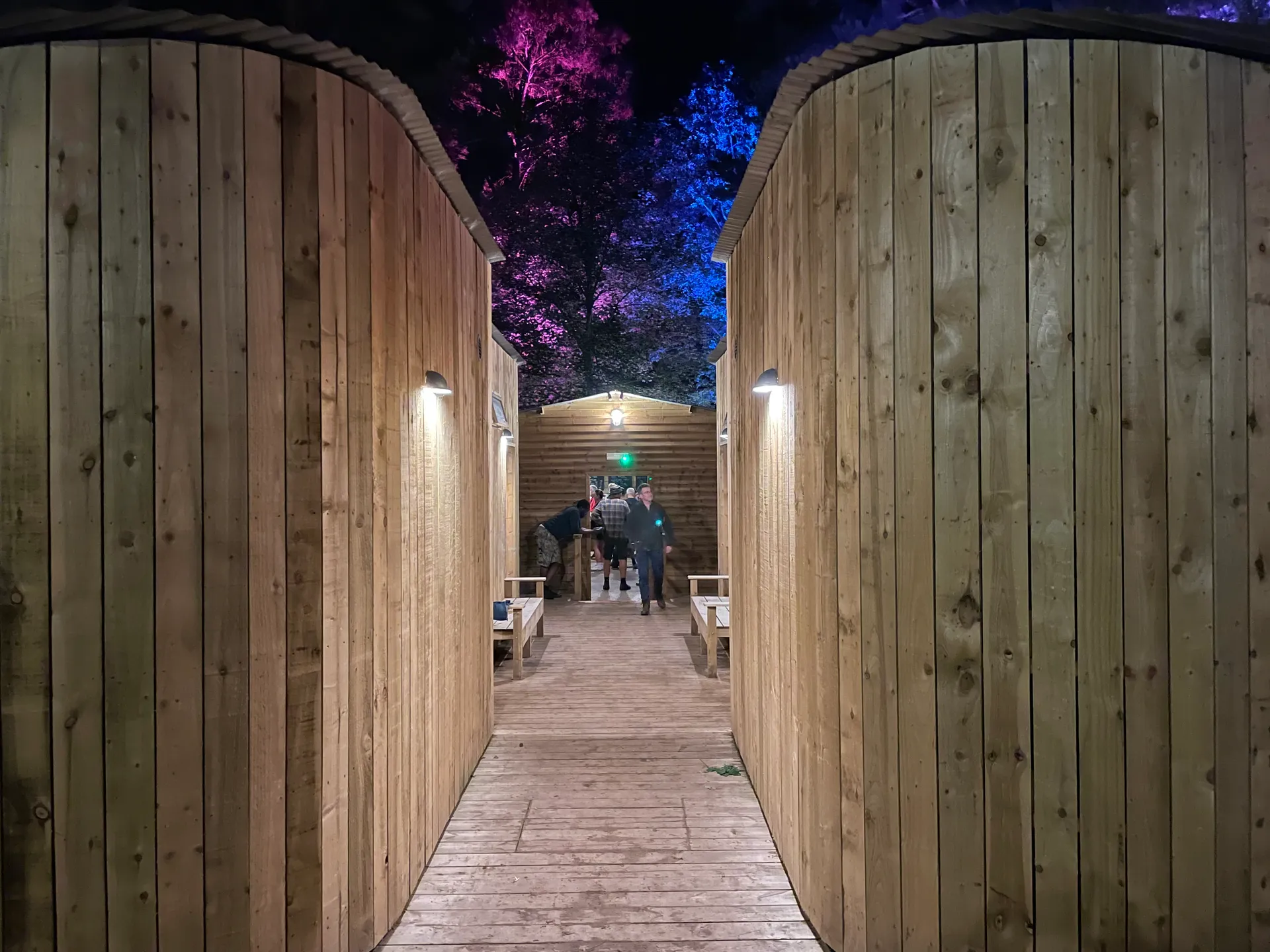 Campsite shower building lit at night