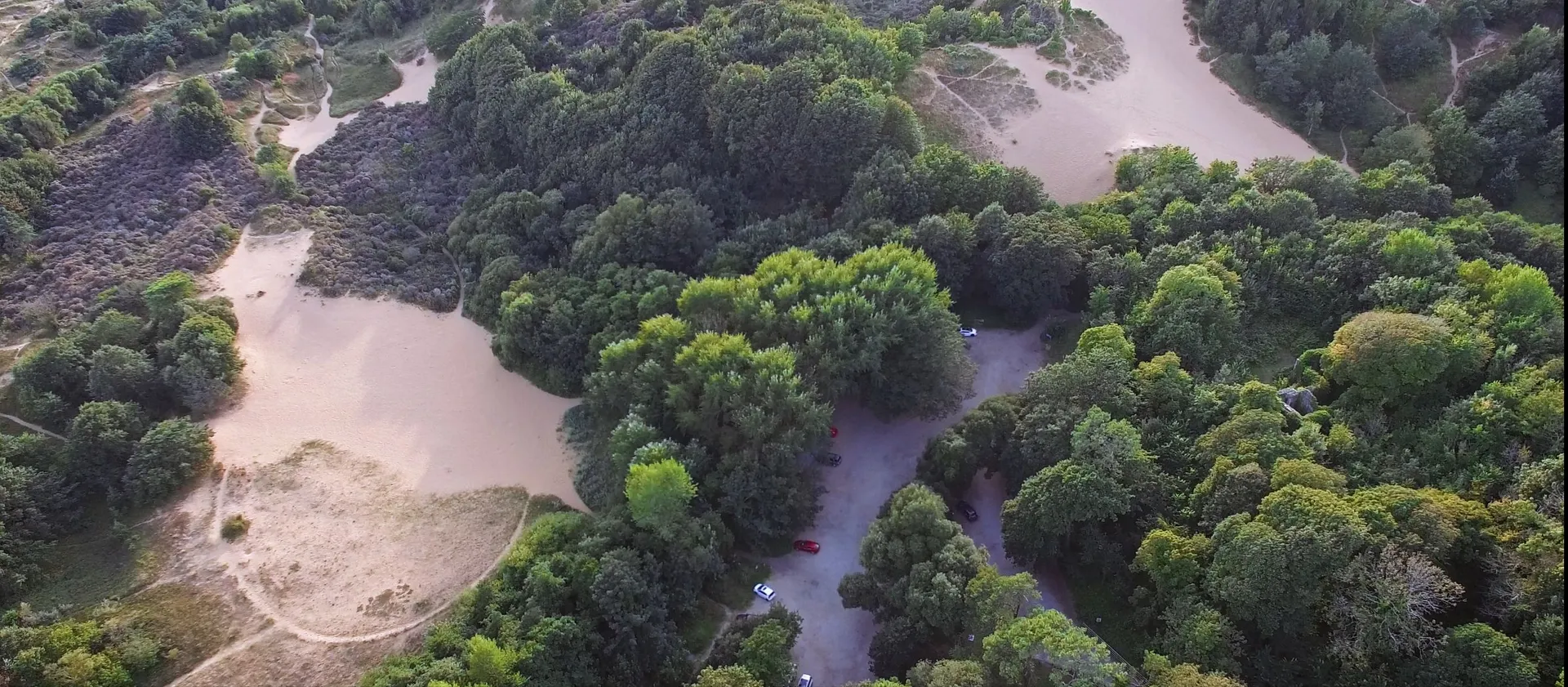 Aerial view of Merthyr Mawr Estate showing rolling green fields and ancient woodland