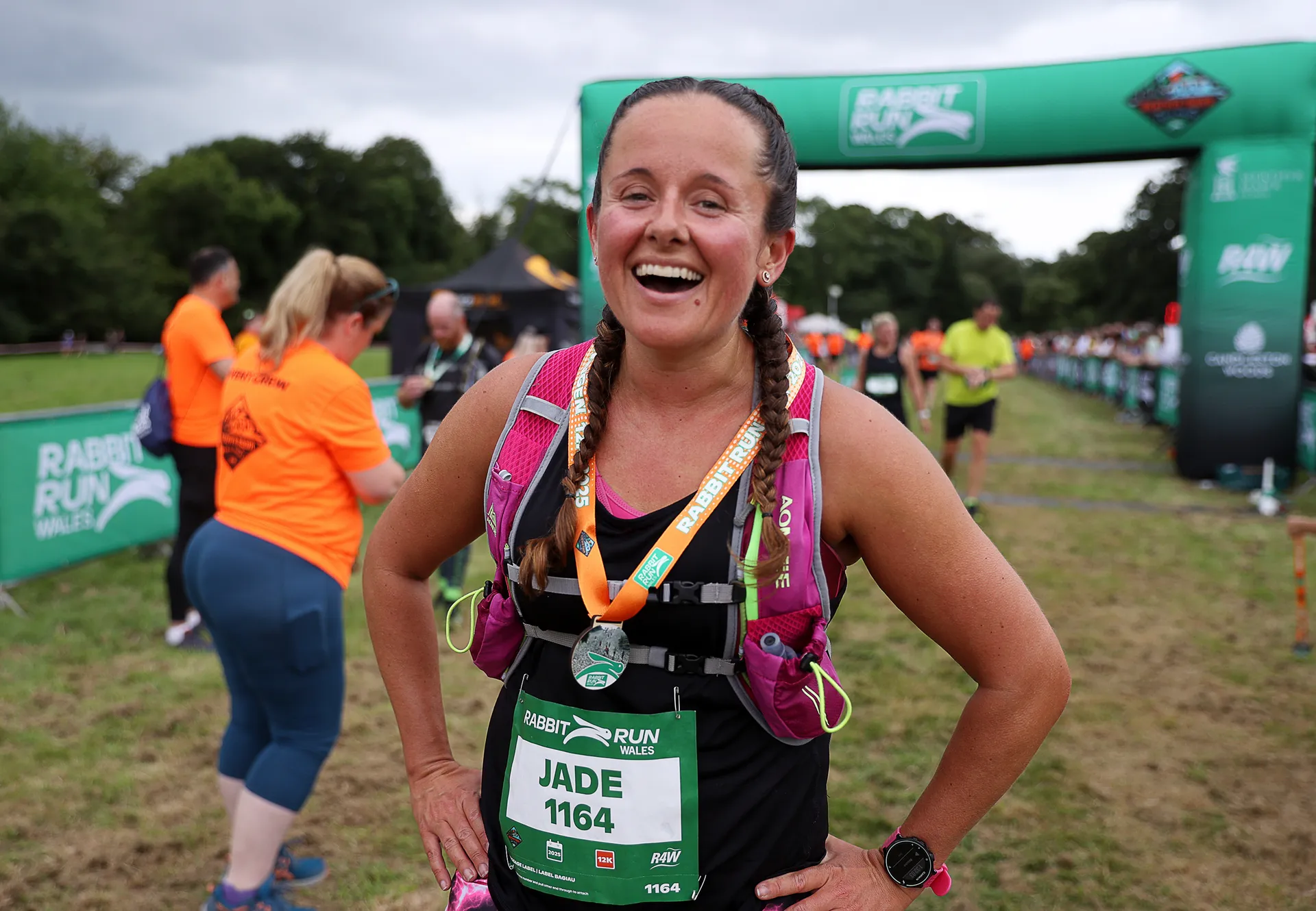 Trail runners moving through event terrain